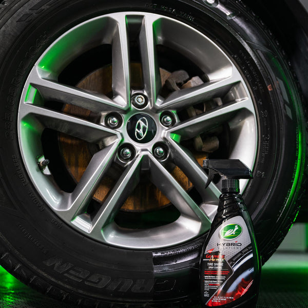 Turtle Wax Hybrid Solutions Graphene Acrylic Tire Shine product shot. Car tire with rim detail. Auto detailing care.